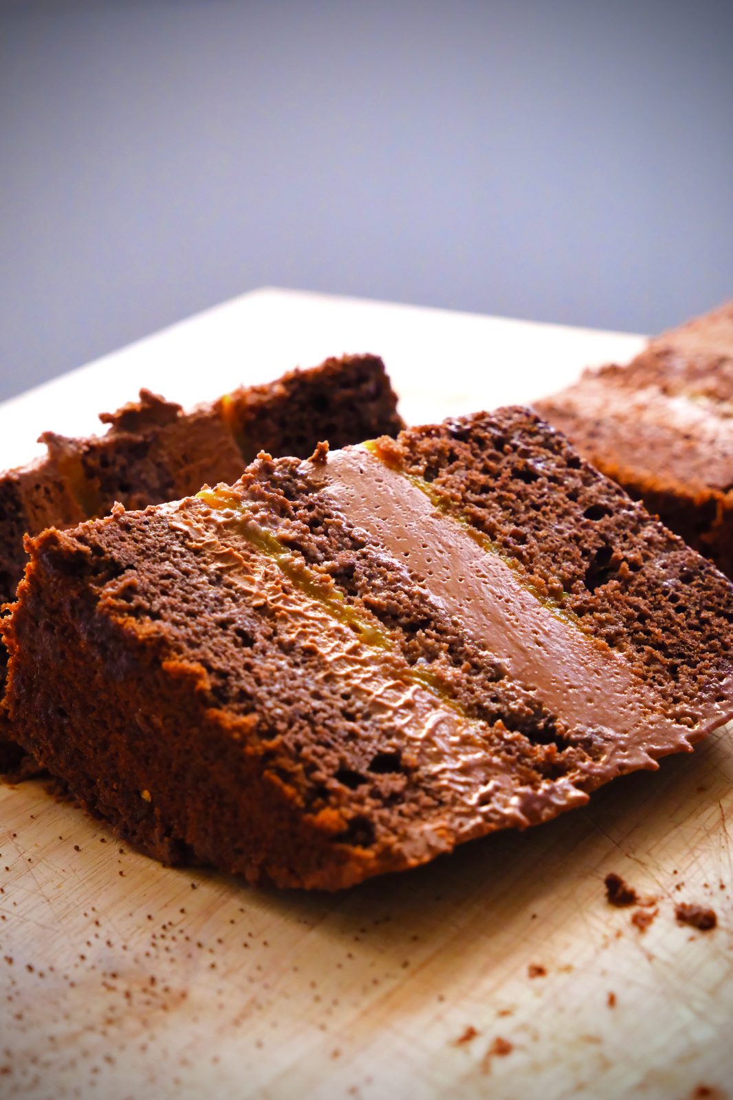 Chocolate loaf cake with caramel filling on cutting board — Dream Bakery
