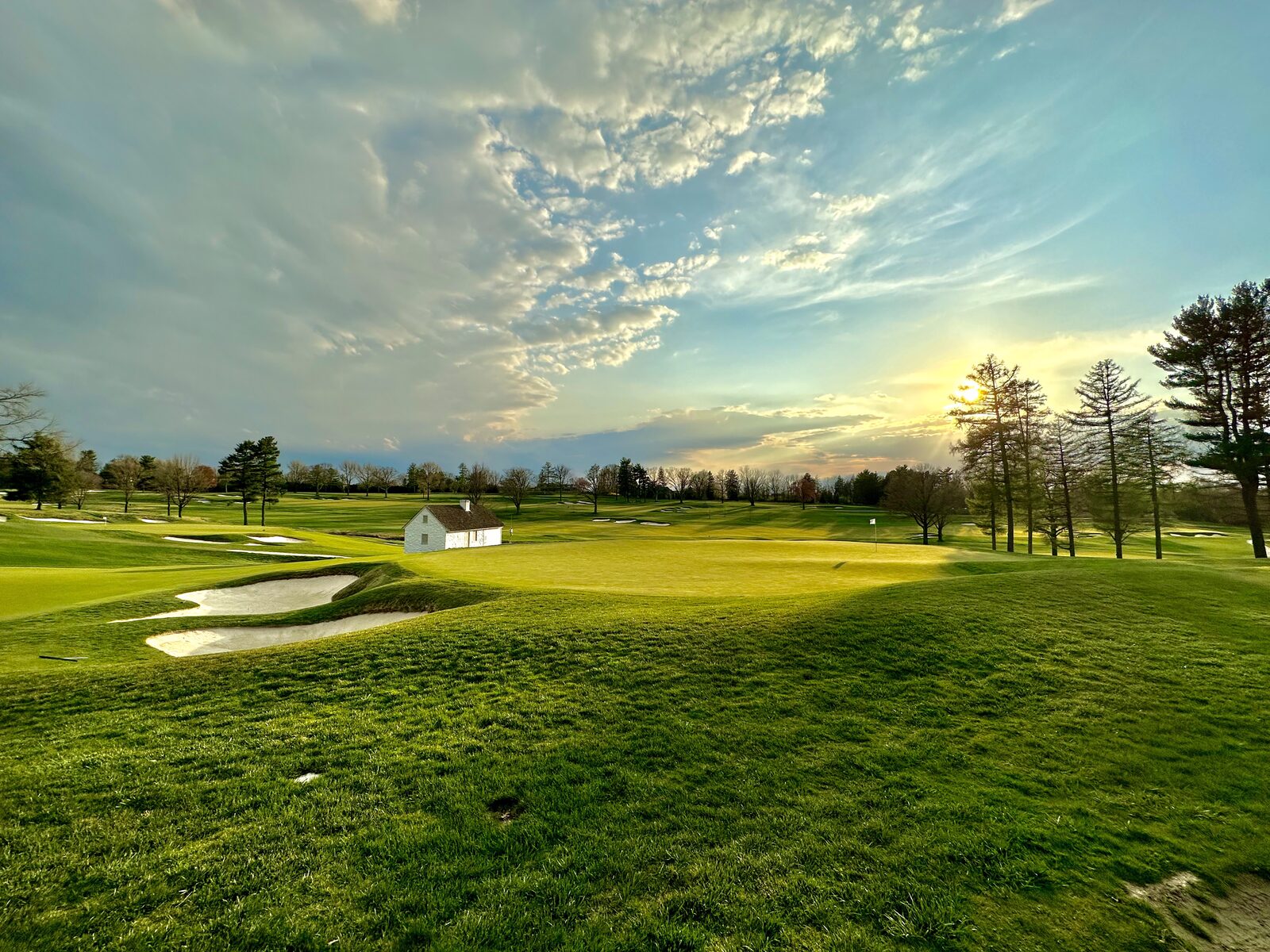 Aronimink Golf Club at golden hour with dramatic sky